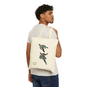 Model carrying a natural cotton canvas tote bag with a sea turtle design and 'Aquatic Views' text. Perfect for daily use.