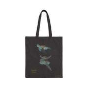 Black cotton canvas tote bag with a colorful sea turtle print and 'Aquatic Views' text. Sturdy 20'' handles, 15''x16'' dimensions.