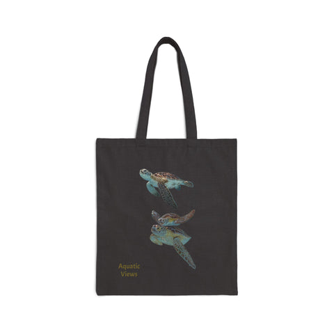 Black cotton canvas tote bag with a colorful sea turtle print and 'Aquatic Views' text. Sturdy 20'' handles, 15''x16'' dimensions.